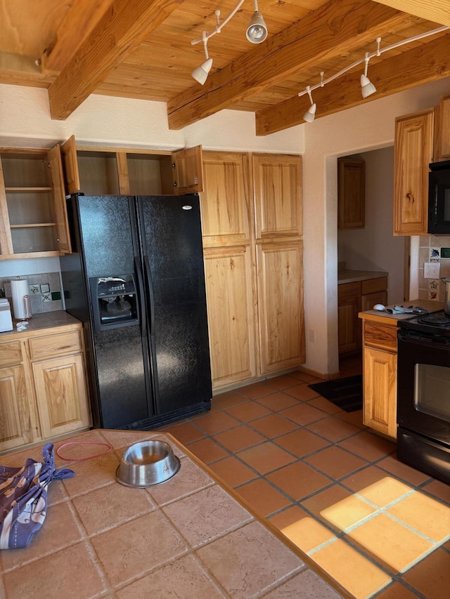403 Candy Kitchen Rd, Ramah, NM 87321 - kitchen featuring black appliances, track lighting, tile counters, and wood ceiling with exposed beams
