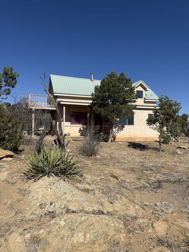 403 Candy Kitchen Rd, Ramah, NM 87321 - view of front facade with stucco siding and metal roof