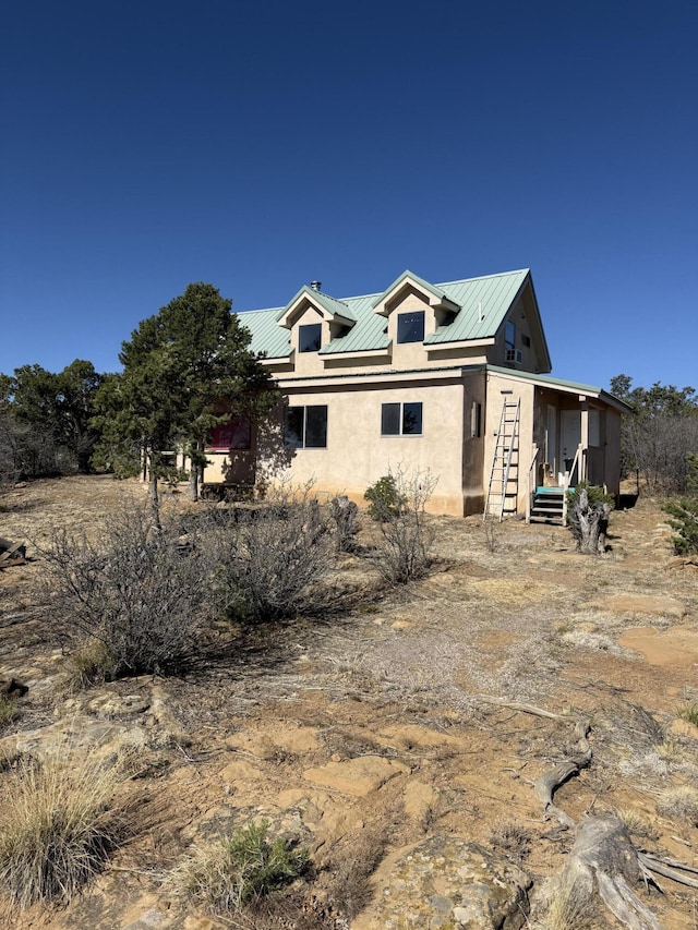 403 Candy Kitchen Rd, Ramah, NM 87321 - view of front of home with stucco siding and metal roof
