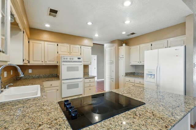1551 Valley View Dr SW, Los Lunas, NM 87031 - unfurnished sunroom featuring a baseboard heating unit, a textured ceiling, baseboards, baseboard heating, and tile patterned flooring