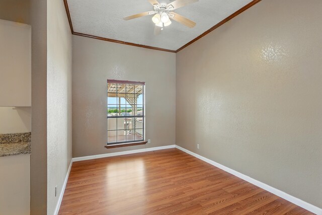 1551 Valley View Dr SW, Los Lunas, NM 87031 - unfurnished room with ornamental molding, light wood-type flooring, baseboards, and a textured ceiling