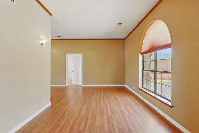 1551 Valley View Dr SW, Los Lunas, NM 87031 - spare room with light wood finished floors, crown molding, and baseboards