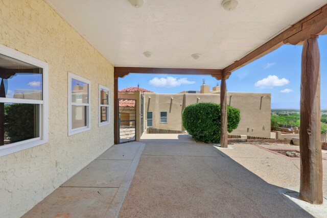 1551 Valley View Dr SW, Los Lunas, NM 87031 - view of patio / terrace featuring french doors and a balcony