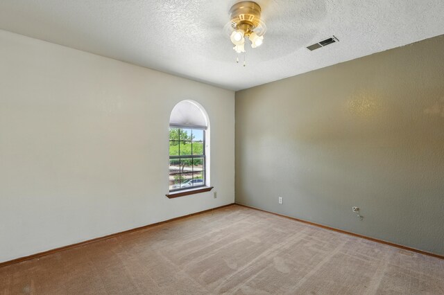 1551 Valley View Dr SW, Los Lunas, NM 87031 - unfurnished bedroom featuring a closet, light colored carpet, baseboards, and a textured ceiling