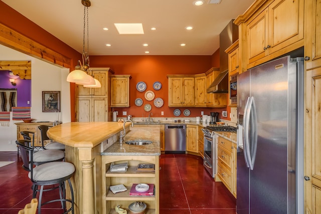 25 Camino Manzano, Placitas, NM 87043 - kitchen with appliances with stainless steel finishes, recessed lighting, light stone counters, a center island with sink, and wall chimney range hood