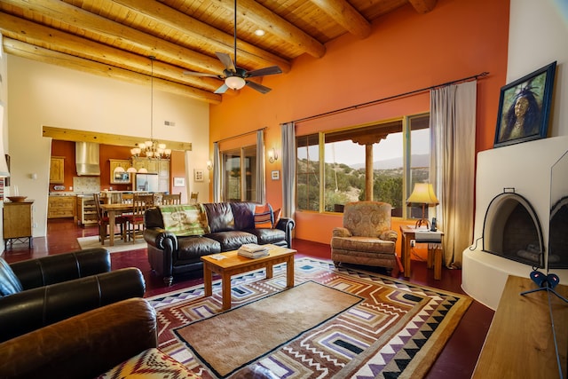 25 Camino Manzano, Placitas, NM 87043 - living area featuring a wooden ceiling with exposed beams, a chandelier, a towering ceiling, and a ceiling fan