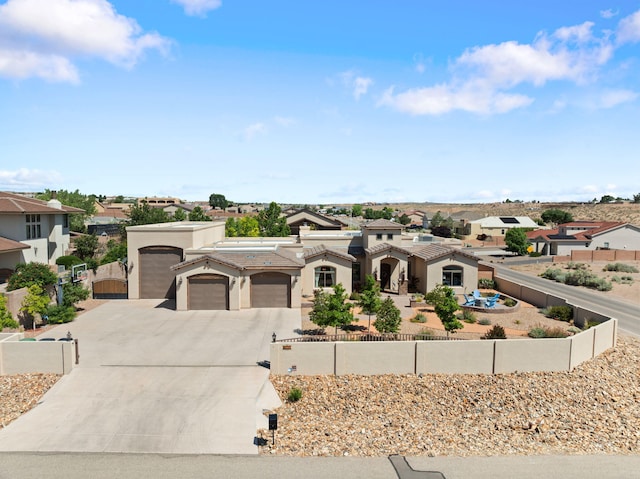2633 Globe Ct NE, Rio Rancho, NM 87124 - view of front of property featuring concrete driveway, a gate, an attached garage, and stucco siding