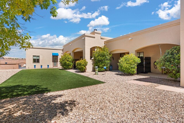 2633 Globe Ct NE, Rio Rancho, NM 87124 - back of property with stucco siding and a chimney
