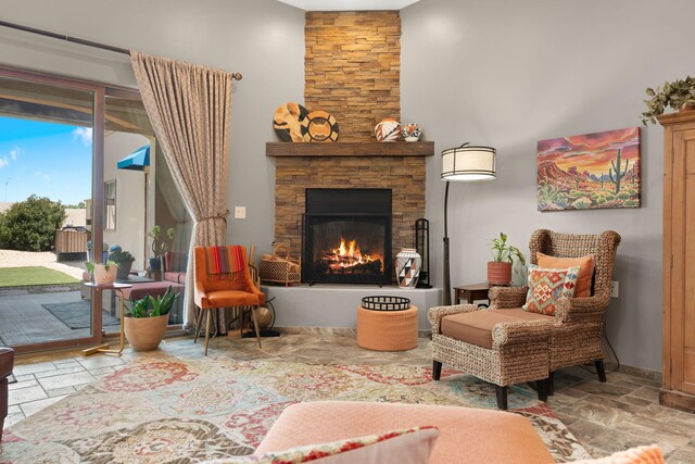 2633 Globe Ct NE, Rio Rancho, NM 87124 - sitting room with stone tile floors and a stone fireplace