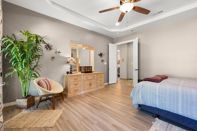 2633 Globe Ct NE, Rio Rancho, NM 87124 - bedroom with light wood finished floors, a raised ceiling, and recessed lighting