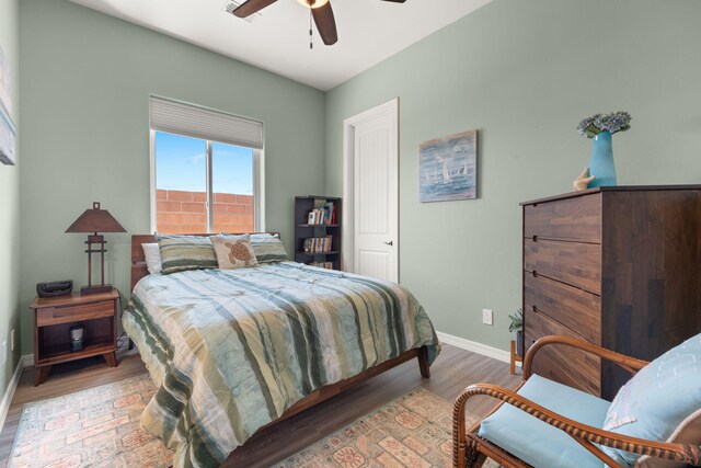 2633 Globe Ct NE, Rio Rancho, NM 87124 - bedroom featuring light wood-style floors and a ceiling fan