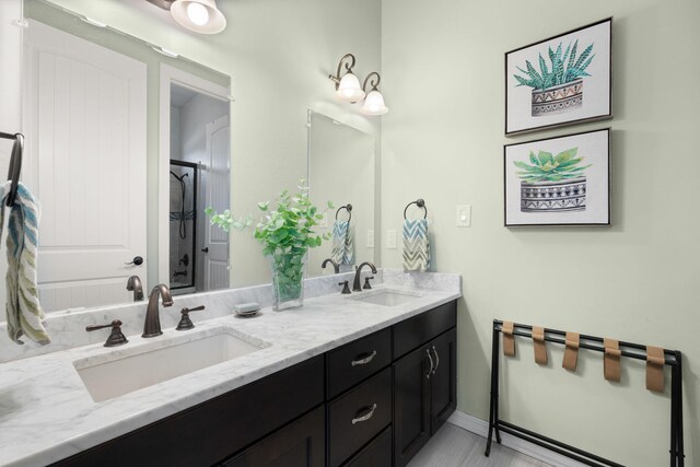 2633 Globe Ct NE, Rio Rancho, NM 87124 - bathroom featuring double vanity and an enclosed shower