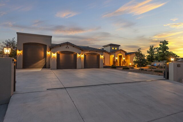 2633 Globe Ct NE, Rio Rancho, NM 87124 - mediterranean / spanish-style house with concrete driveway, a garage, and stucco siding