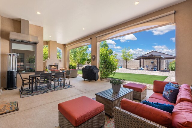 2633 Globe Ct NE, Rio Rancho, NM 87124 - view of patio with an outdoor living space with a fireplace, a grill, outdoor dining space, and a gazebo