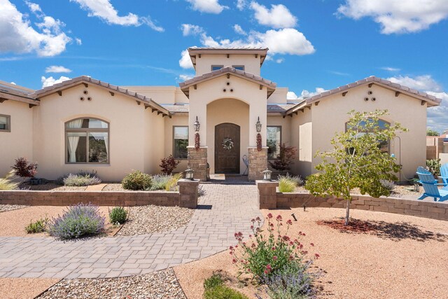 2633 Globe Ct NE, Rio Rancho, NM 87124 - mediterranean / spanish-style house with stucco siding and a tiled roof