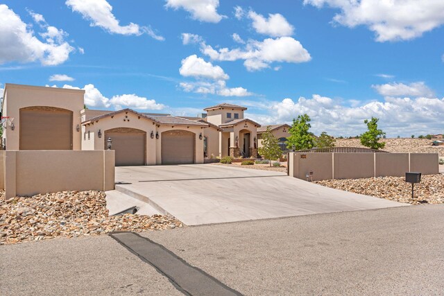 2633 Globe Ct NE, Rio Rancho, NM 87124 - view of front of home with a garage, driveway, and stucco siding