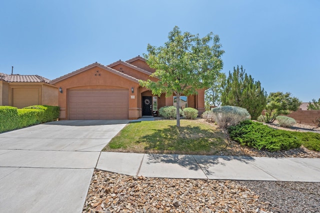 429 Paseo Vista Loop NE, Rio Rancho, NM 87124 - view of front facade with a garage, stucco siding, driveway, and a tile roof