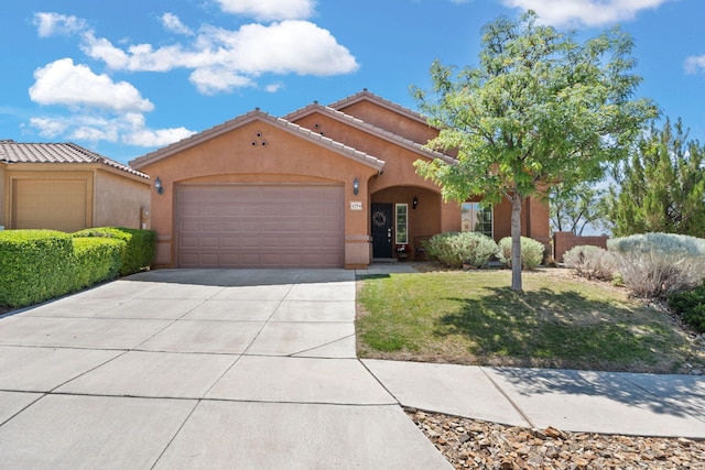 429 Paseo Vista Loop NE, Rio Rancho, NM 87124 - mediterranean / spanish home with stucco siding, an attached garage, concrete driveway, a tile roof, and a front yard