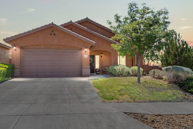 429 Paseo Vista Loop NE, Rio Rancho, NM 87124 - view of front of property with stucco siding, driveway, a garage, and a tiled roof