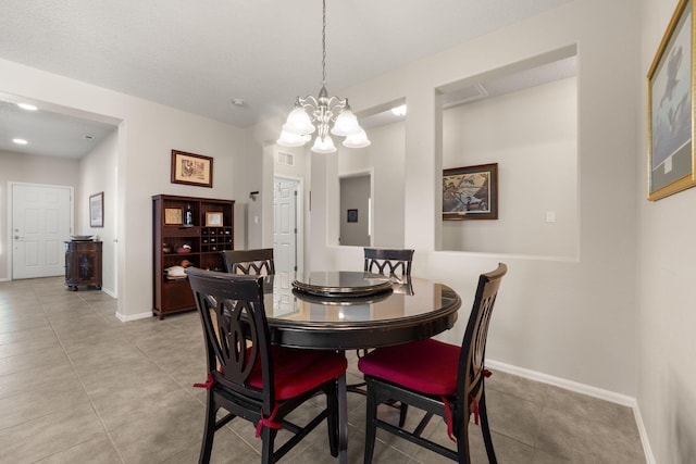 429 Paseo Vista Loop NE, Rio Rancho, NM 87124 - dining area with light tile patterned floors, a chandelier, and baseboards