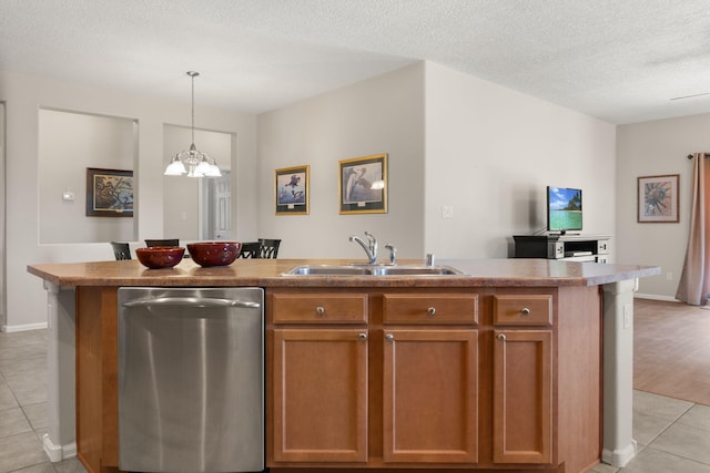 429 Paseo Vista Loop NE, Rio Rancho, NM 87124 - kitchen with dishwasher, a sink, light tile patterned floors, brown cabinetry, and a chandelier