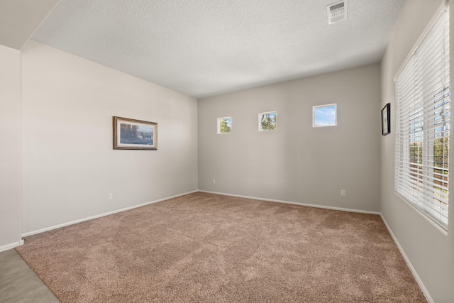 429 Paseo Vista Loop NE, Rio Rancho, NM 87124 - carpeted empty room featuring a textured ceiling and baseboards