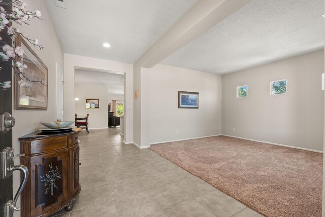 429 Paseo Vista Loop NE, Rio Rancho, NM 87124 - foyer entrance featuring light carpet, baseboards, light tile patterned floors, recessed lighting, and a textured ceiling