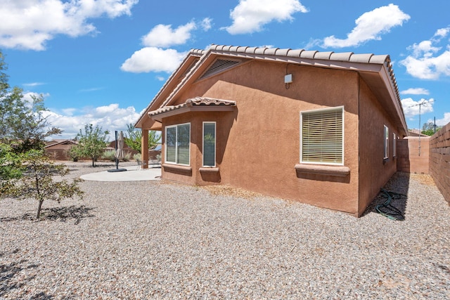 429 Paseo Vista Loop NE, Rio Rancho, NM 87124 - rear view of house with a patio area, a fenced backyard, stucco siding, and a tile roof