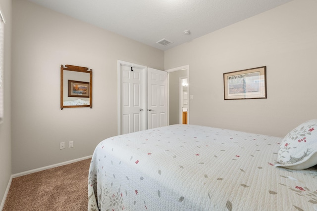 429 Paseo Vista Loop NE, Rio Rancho, NM 87124 - carpeted bedroom with a closet and baseboards