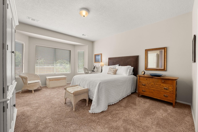 429 Paseo Vista Loop NE, Rio Rancho, NM 87124 - bedroom featuring carpet floors, a textured ceiling, and baseboards