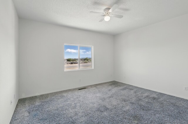 10016 Rio Canon Ave SW, Albuquerque, NM 87121 - unfurnished room featuring carpet, ceiling fan, and a textured ceiling
