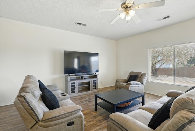 10016 Rio Canon Ave SW, Albuquerque, NM 87121 - living area featuring wood finished floors, a ceiling fan, and a textured ceiling
