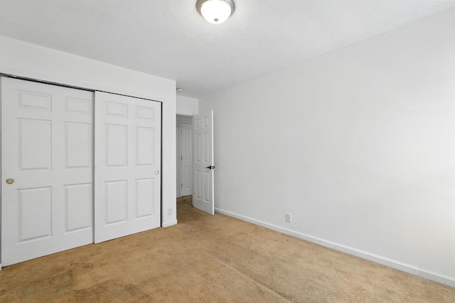 5940 Night Rose Ave NW, Albuquerque, NM 87114 - unfurnished bedroom with carpet, a closet, and baseboards