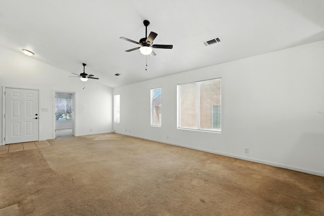 5940 Night Rose Ave NW, Albuquerque, NM 87114 - empty room featuring lofted ceiling, light colored carpet, a ceiling fan, and baseboards