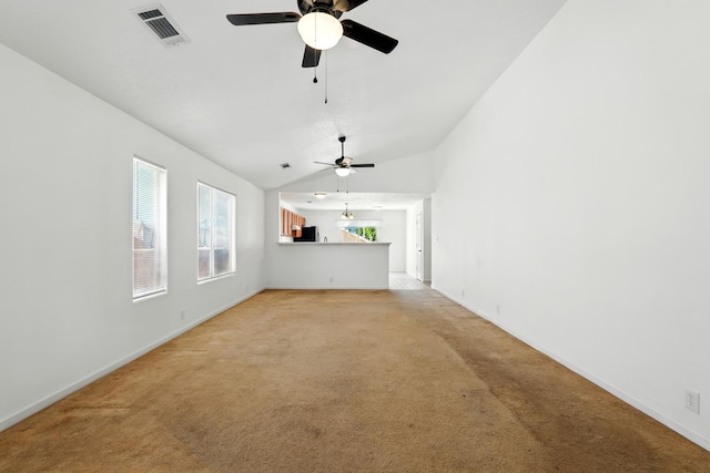 5940 Night Rose Ave NW, Albuquerque, NM 87114 - unfurnished living room featuring ceiling fan, light carpet, baseboards, and vaulted ceiling