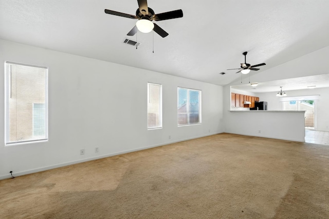 5940 Night Rose Ave NW, Albuquerque, NM 87114 - unfurnished living room with vaulted ceiling, a ceiling fan, baseboards, and light carpet