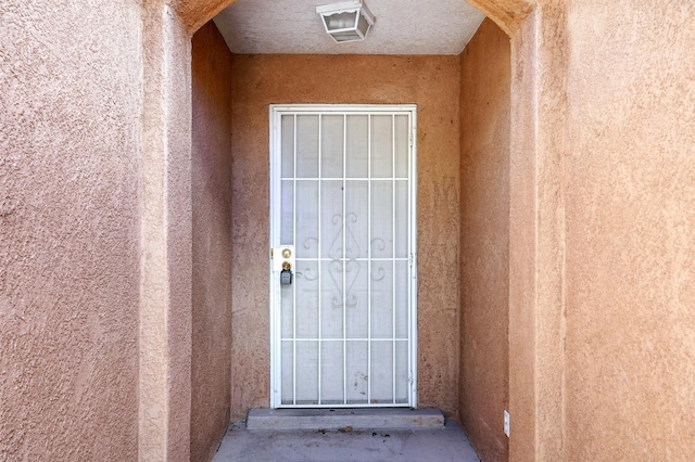 5940 Night Rose Ave NW, Albuquerque, NM 87114 - view of exterior entry with stucco siding
