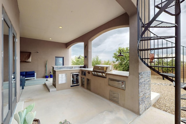 3220 Vatapa Rd NE, Rio Rancho, NM 87144 - view of patio / terrace with beverage cooler and stairs