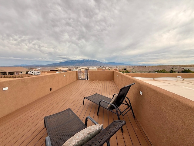 3220 Vatapa Rd NE, Rio Rancho, NM 87144 - wooden deck with a mountain view