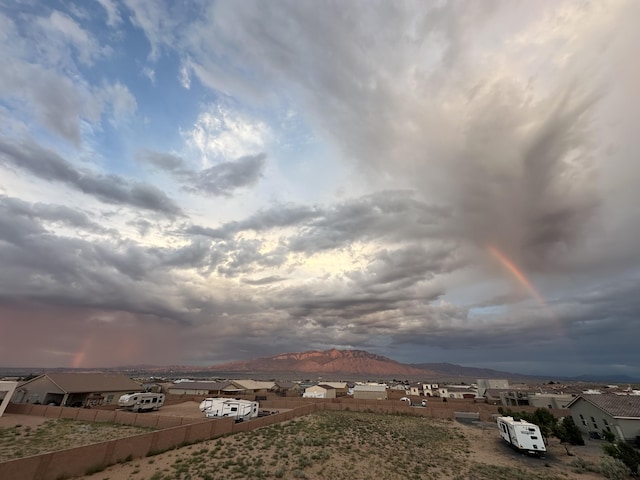 3220 Vatapa Rd NE, Rio Rancho, NM 87144 - water view featuring a mountain backdrop and nearby suburban area