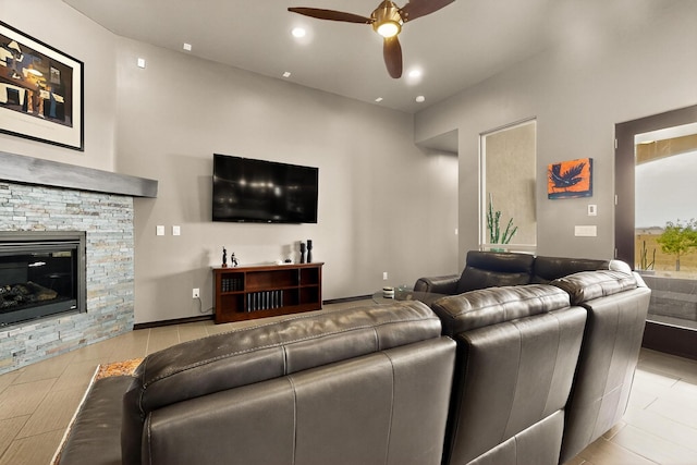3220 Vatapa Rd NE, Rio Rancho, NM 87144 - living area with a ceiling fan, a stone fireplace, and recessed lighting