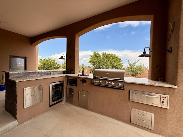 3220 Vatapa Rd NE, Rio Rancho, NM 87144 - view of patio / terrace with wine cooler