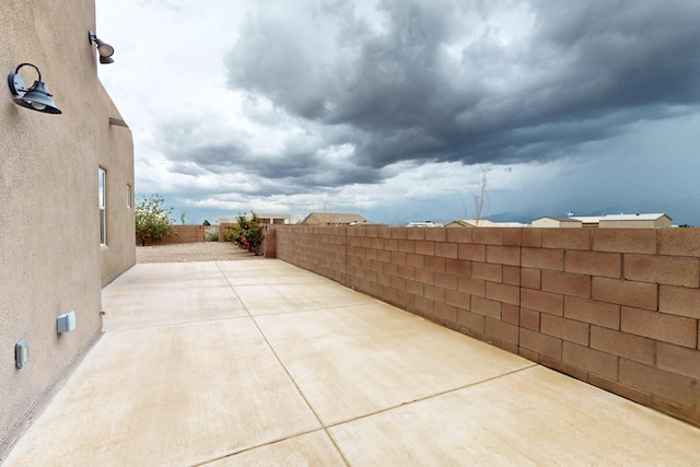 3220 Vatapa Rd NE, Rio Rancho, NM 87144 - fenced backyard with a patio