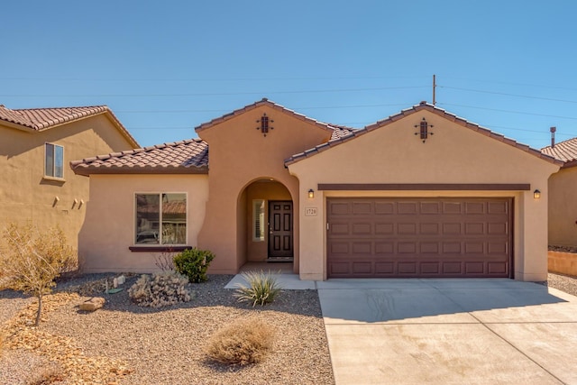 1720 Summer Breeze Dr NW, Albuquerque, NM 87120 - mediterranean / spanish-style house with an attached garage, stucco siding, driveway, and a tile roof