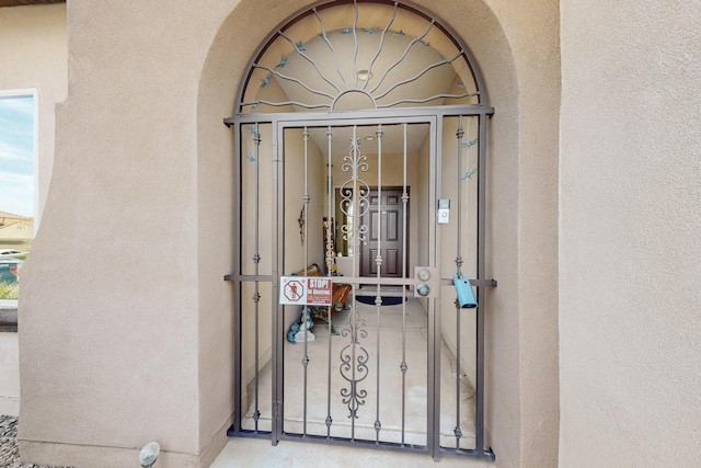 1720 Summer Breeze Dr NW, Albuquerque, NM 87120 - entrance to property with stucco siding and a gate