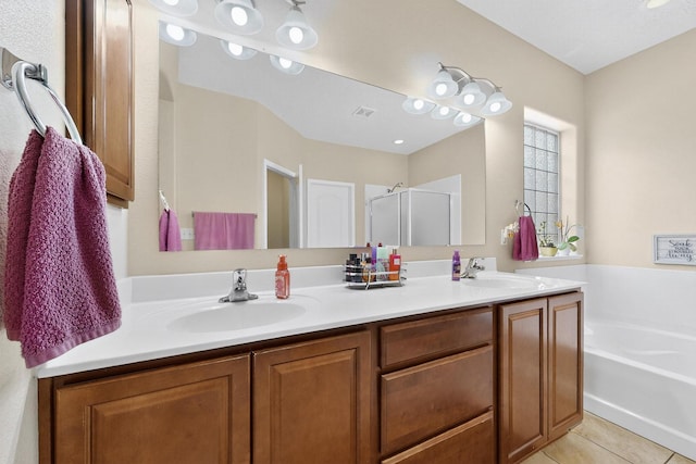 1720 Summer Breeze Dr NW, Albuquerque, NM 87120 - bathroom featuring double vanity, a stall shower, a garden tub, and tile patterned flooring