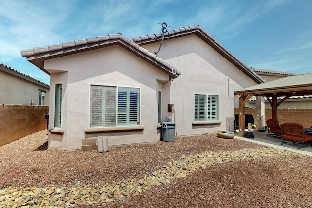 1720 Summer Breeze Dr NW, Albuquerque, NM 87120 - back of house with a gazebo, a patio area, and stucco siding