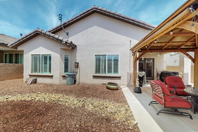 1720 Summer Breeze Dr NW, Albuquerque, NM 87120 - rear view of property featuring stucco siding and a patio area
