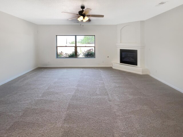 10909 Estribo St NW, Albuquerque, NM 87114 - unfurnished living room featuring a ceiling fan, a large fireplace, baseboards, and carpet