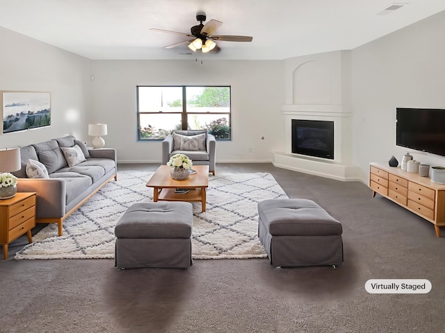 10909 Estribo St NW, Albuquerque, NM 87114 - living area featuring ceiling fan, baseboards, a glass covered fireplace, and carpet floors